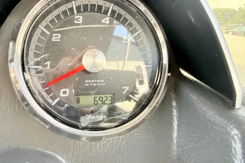 Slide: The Image of Close-up of AquaPatio 240 RS 2013 tachometer showing 693.1 hours. - 9