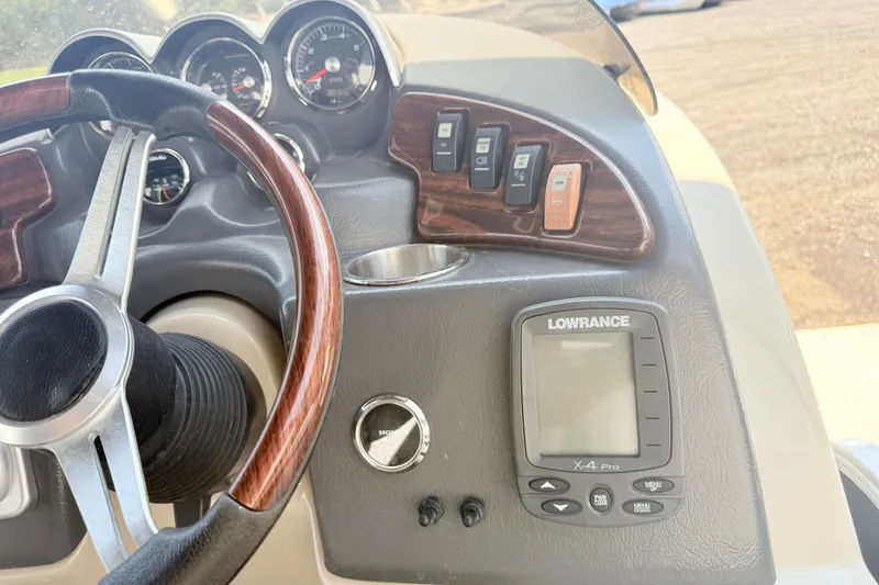 Slide: The Image of Dashboard of 2013 AquaPatio 240 RS with steering wheel and Lowrance X-4 Pro display. - 10