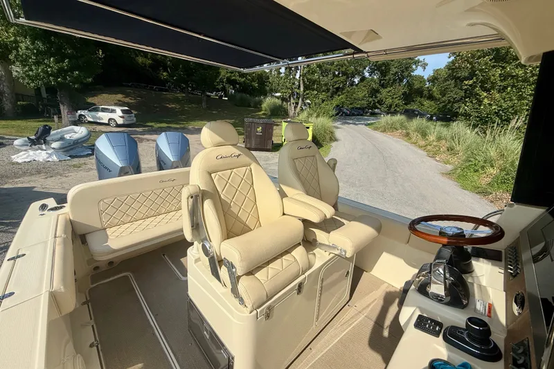 Slide: The Image of 2019 Chris-Craft Catalina 30 boat interior with luxurious seating and dual Mercury engines. - 21