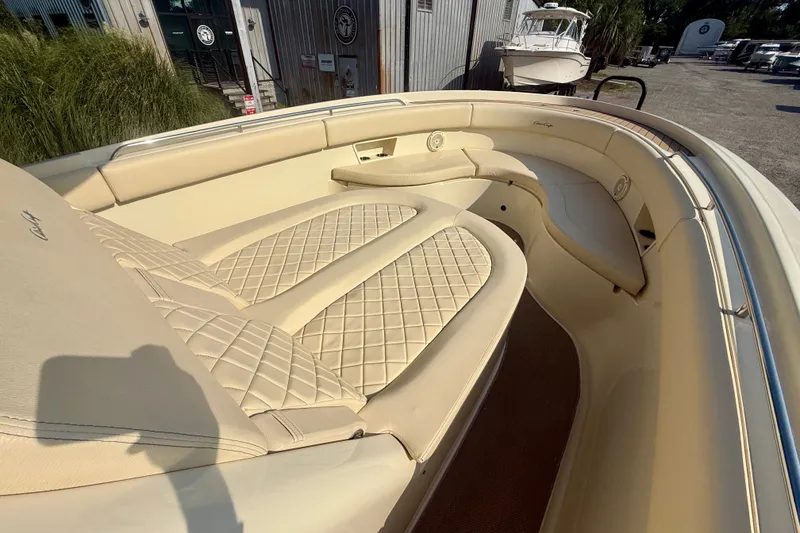 Slide: The Image of 2019 Chris-Craft Catalina 30 boat interior with beige quilted seating. - 22