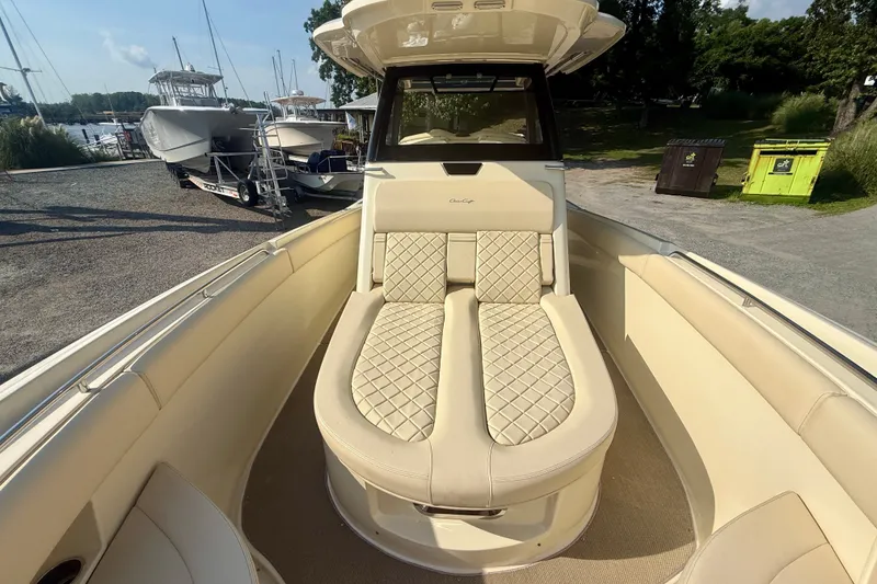 Slide: The Image of 2019 Chris-Craft Catalina 30 boat with luxurious beige seating and elegant design. - 24