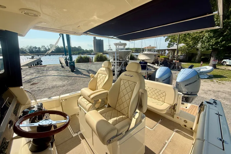 Slide: The Image of 2019 Chris-Craft Catalina 30 boat interior with luxurious seating and dual Mercury engines. - 18