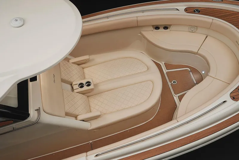 Slide: The Image of Manufacturer Provided Image: 2019 Chris-Craft Catalina 30 boat interior with beige seating and wood accents. - 8