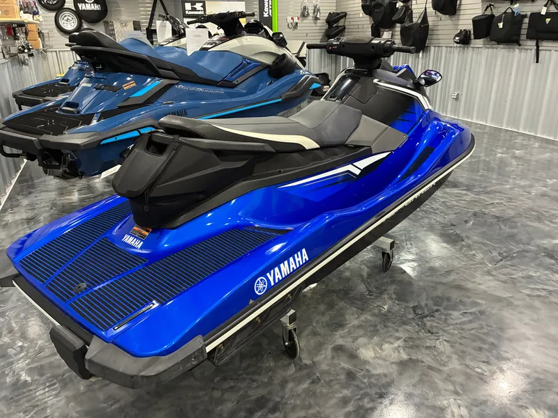 Slide: The Image of A blue 2018 Yamaha EX Deluxe jet ski is displayed on a showroom floor. - 4