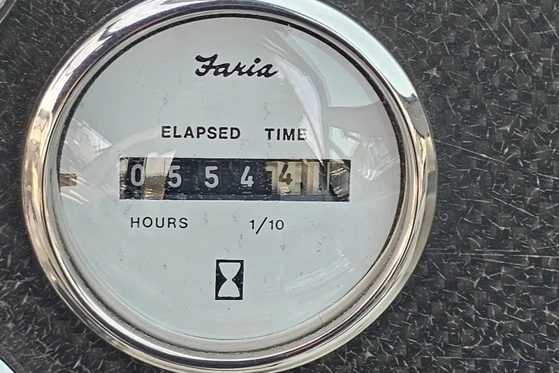 Slide: The Image of Elapsed time gauge on 2001 Mustang 3200 Sport Cruiser, showing 554.1 hours. - 23