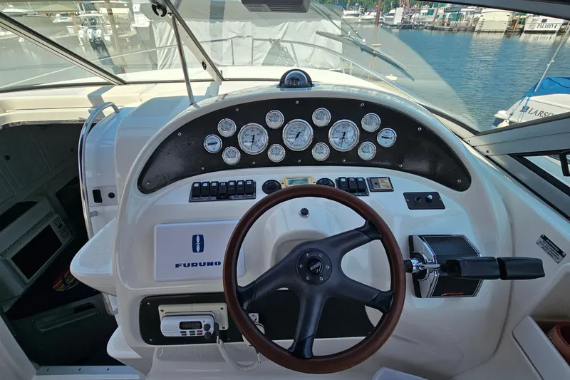 Slide: The Image of Cockpit of 2001 Mustang 3200 Sport Cruiser with steering wheel and instrument panel. - 12