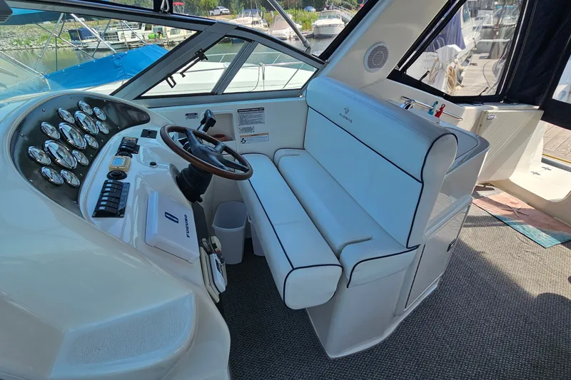 Slide: The Image of 2001 Mustang 3200 Sport Cruiser cockpit with steering wheel and control panel. - 10