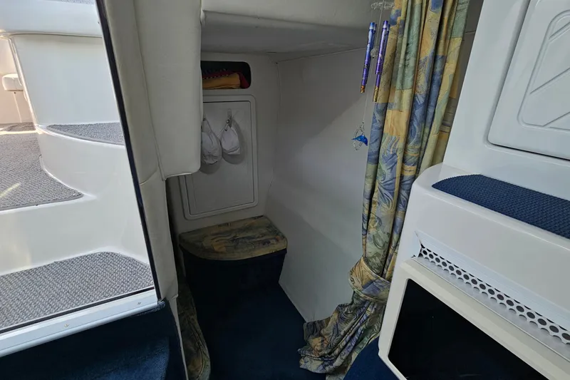 Slide: The Image of Interior of 2001 Mustang 3200 Sport Cruiser with stairs and patterned curtains. - 19