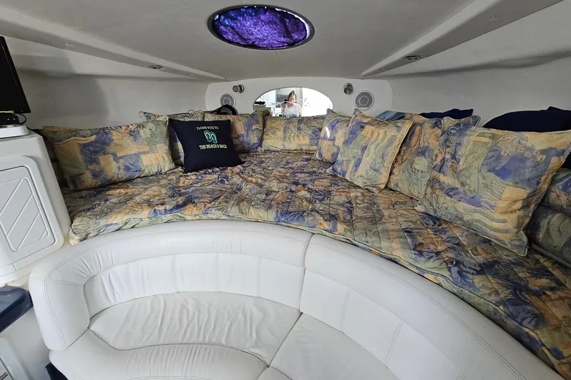Slide: The Image of Interior of 2001 Mustang 3200 Sport Cruiser with plush bedding and circular seating. - 16