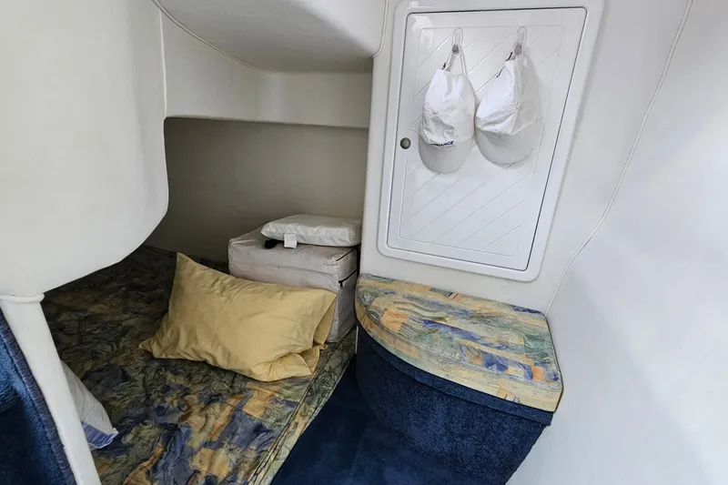 Slide: The Image of Interior cabin of 2001 Mustang 3200 Sport Cruiser with bed and storage. - 20