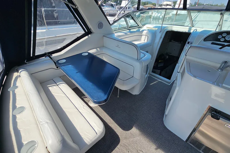 Slide: The Image of 2001 Mustang 3200 Sport Cruiser interior with seating and table, showcasing luxury design. - 7