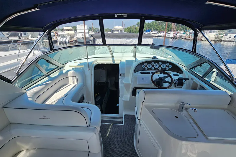 Slide: The Image of Interior view of a 2001 Mustang 3200 Sport Cruiser at a marina. - 13