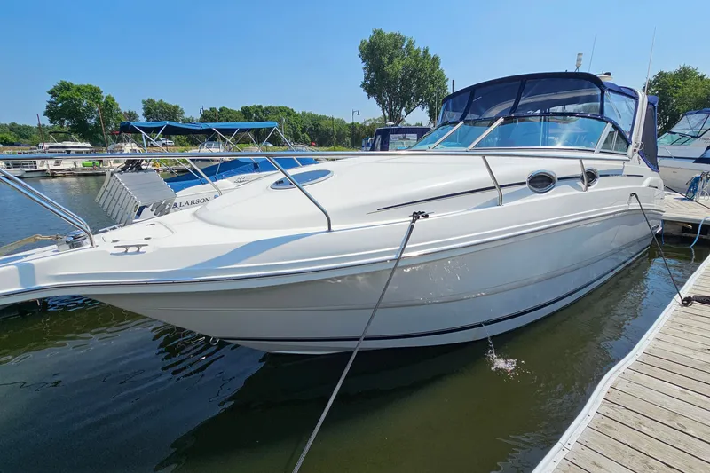 Slide: The Image of 2001 Mustang 3200 Sport Cruiser docked at marina on a sunny day. - 4