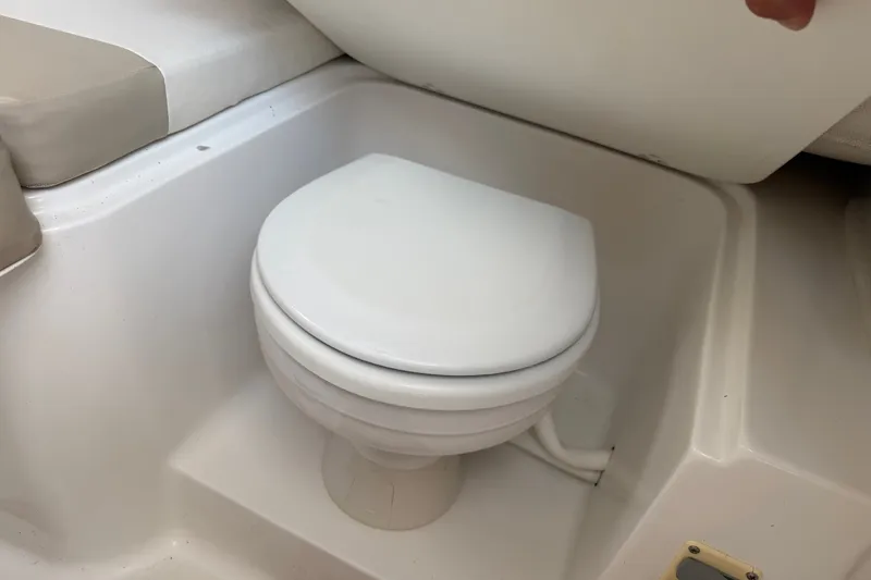 Slide: The Image of Boat toilet in a 2013 Sea Fox 256 Voyager, featuring a compact design. - 31