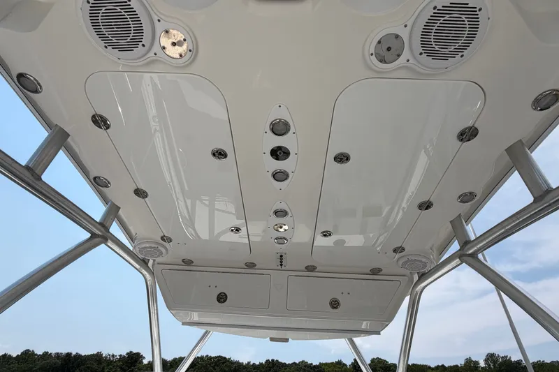 Slide: The Image of 2013 Sea Fox 256 Voyager boat ceiling with speakers and lighting fixtures. - 19
