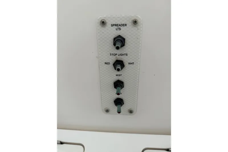 Slide: The Image of Control panel on a 2013 Sea Fox 256 Voyager boat with labeled switches. - 11