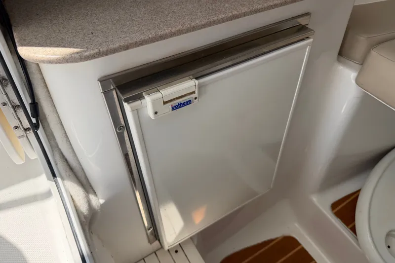 Slide: The Image of Compact refrigerator in 2013 Sea Fox 256 Voyager boat interior. - 30