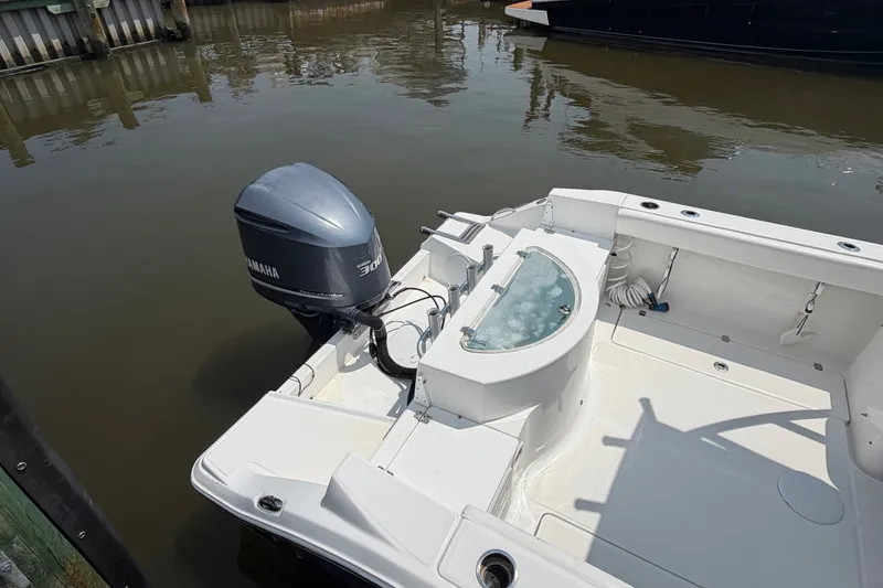 Slide: The Image of 2013 Sea Fox 256 Voyager boat with Yamaha 300 outboard motor at dock. - 11