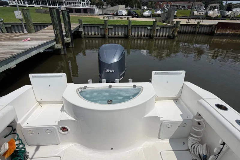 Slide: The Image of 2013 Sea Fox 256 Voyager boat with Yamaha 300 engine docked at marina. - 15