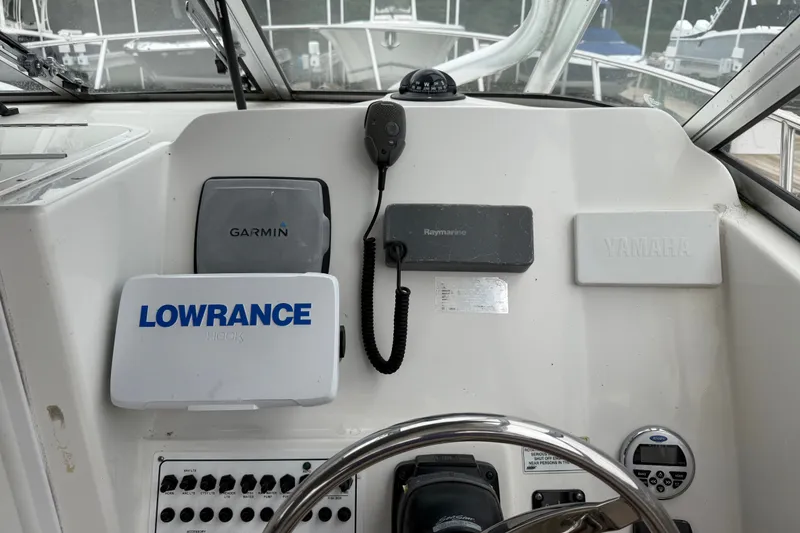 Slide: The Image of Control panel of a 2013 Sea Fox 256 Voyager with Garmin, Lowrance, Raymarine, and Yamaha equipment. - 7