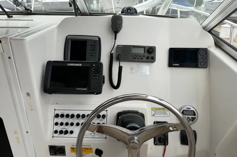 Slide: The Image of Control panel of a 2013 Sea Fox 256 Voyager boat with navigation equipment. - 8