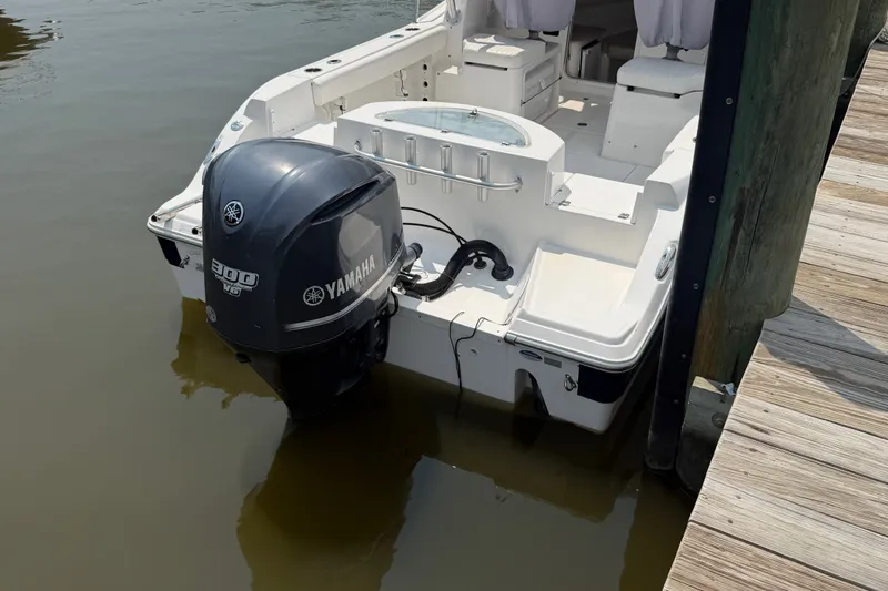 Slide: The Image of 2013 Sea Fox 256 Voyager boat with Yamaha 300 engine docked at marina. - 10