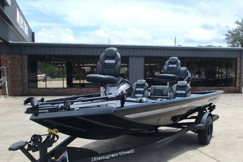 Slide: The Image of 2027 Ranger RT178 fishing boat on trailer, parked outside a dealership. - 8