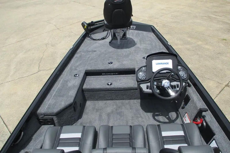 Slide: The Image of 2027 Ranger RT178 boat interior with steering console and seating, featuring Lowrance electronics. - 7