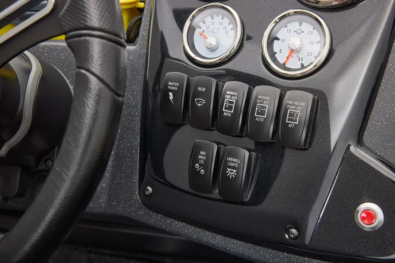 Slide: The Image of Control panel of 2027 Tracker Targa V-18 Combo boat with gauges and switches. - 15