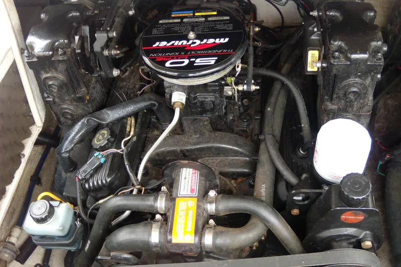 Slide: The Image of Engine compartment of a 1998 Sea Ray 210 Sundeck with MerCruiser components. - 5