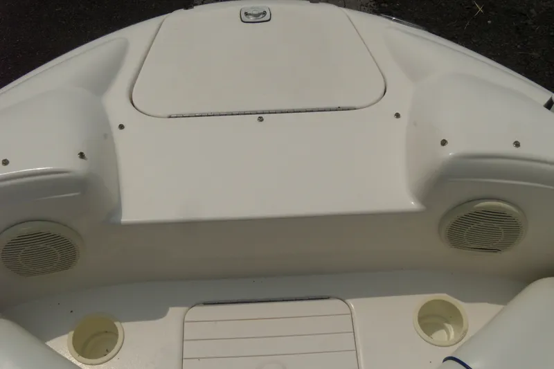 Slide: The Image of 1998 Sea Ray 210 Sundeck boat interior with speakers and storage compartments. - 11