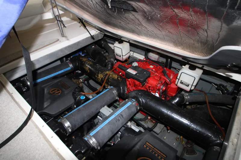Slide: The Image of Engine compartment of 2000 Sea Ray 310 Sundancer with visible components and wiring. - 29