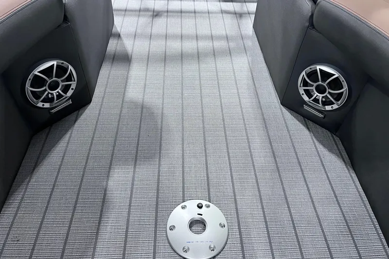 Slide: The Image of Interior of 2026 Sylvan L3 LZ DH boat with speakers and textured flooring. - 26