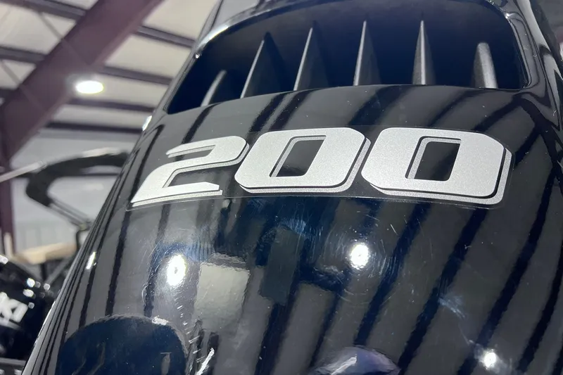 Slide: The Image of Close-up of a 2026 Sylvan L3 LZ DH boat engine with "200" label. - 28