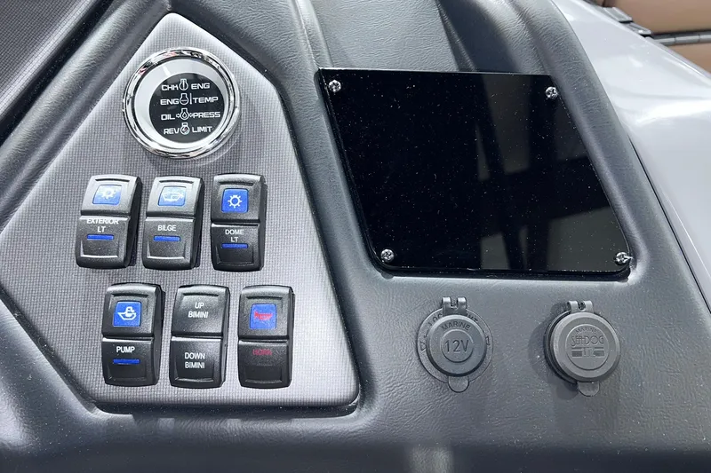 Slide: The Image of Dashboard controls of 2026 Sylvan L3 LZ DH boat with various switches and gauges. - 17