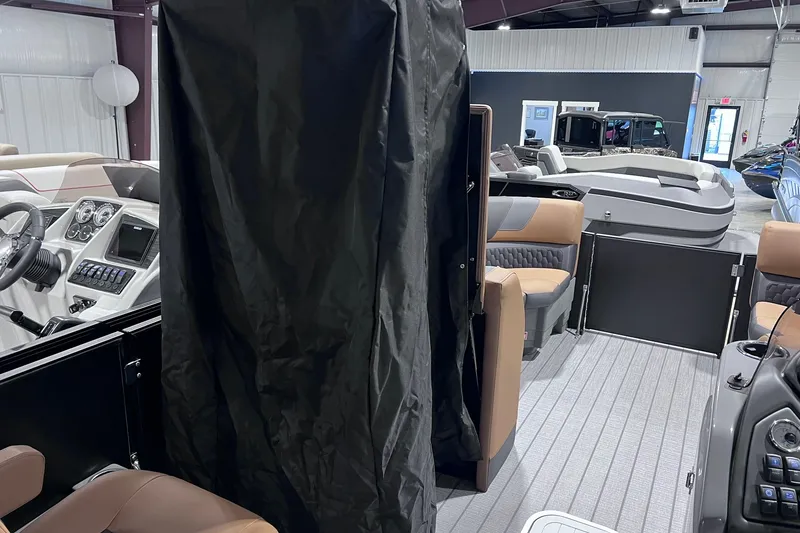 Slide: The Image of Interior of 2026 Sylvan L3 LZ DH boat with modern dashboard and seating. - 23