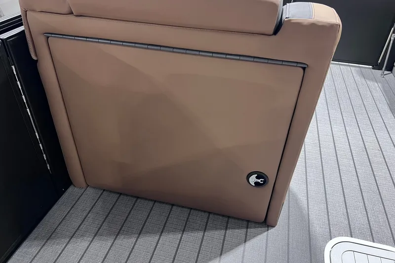 Slide: The Image of 2026 Sylvan L3 LZ DH boat interior with tan upholstery and sleek design. - 21