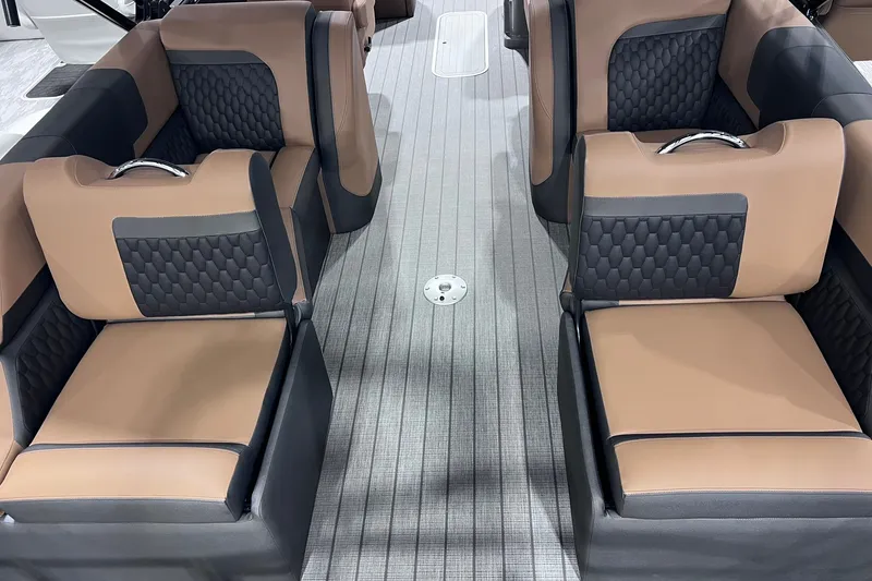 Slide: The Image of Luxurious seating on the 2026 Sylvan L3 LZ DH boat, featuring elegant brown and black upholstery. - 9