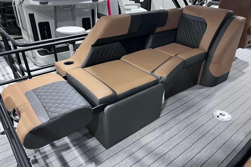 Slide: The Image of Luxurious seating on 2026 Sylvan L3 LZ DH boat, featuring brown and black upholstery. - 14