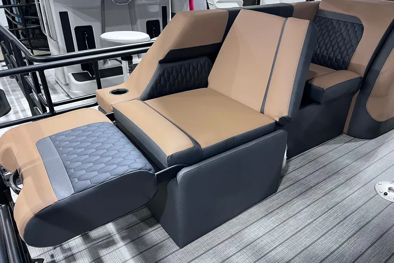 Slide: The Image of Luxurious seating on 2026 Sylvan L3 LZ DH boat, featuring tan and gray upholstery. - 11