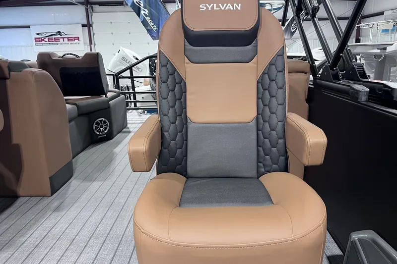 Slide: The Image of Luxurious Sylvan L3 LZ DH 2026 boat seat with brown and black upholstery. - 6