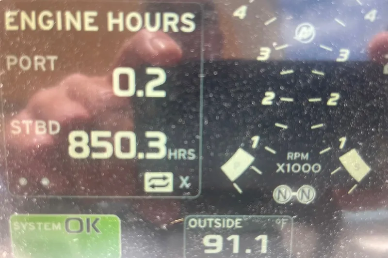 Slide: The Image of Close-up of 2003 Sea Ray 360 Sundancer engine hours display, showing 850.3 hours. - 35