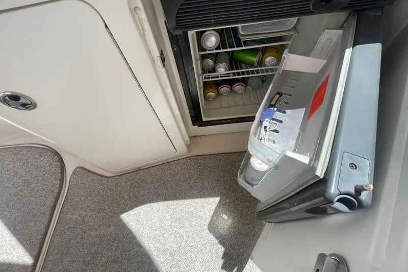 Slide: The Image of Mini fridge on 2003 Sea Ray 360 Sundancer yacht, stocked with beverages. - 15