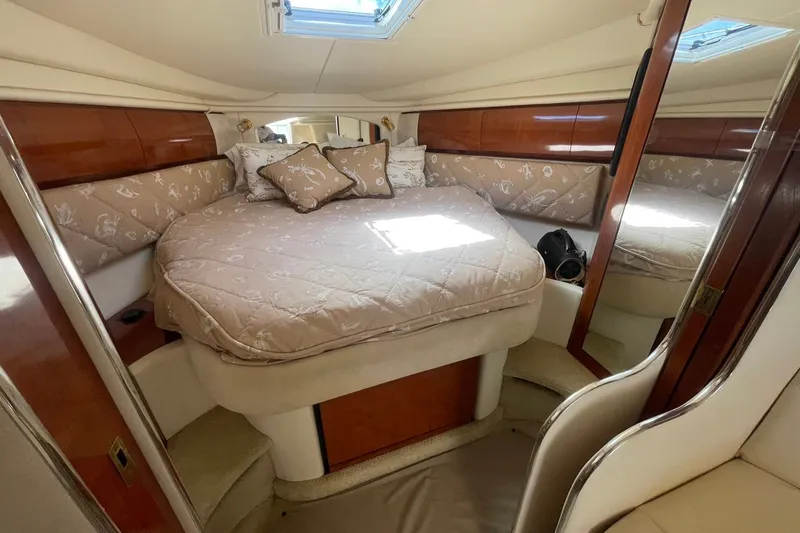 Slide: The Image of Luxurious cabin interior of 2003 Sea Ray 360 Sundancer yacht with plush bedding. - 24