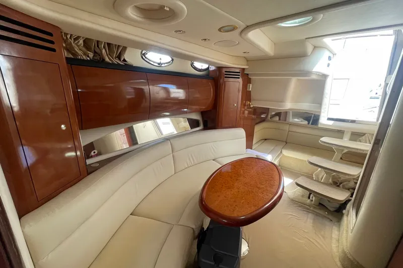 Slide: The Image of Luxurious interior of a 2003 Sea Ray 360 Sundancer yacht with elegant wood finishes. - 28