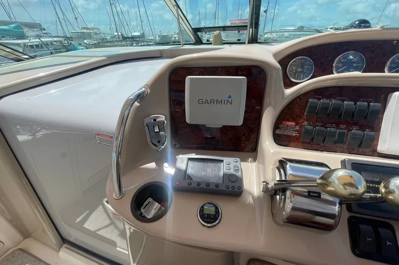 Slide: The Image of 2003 Sea Ray 360 Sundancer helm with Garmin navigation system and control panel. - 14