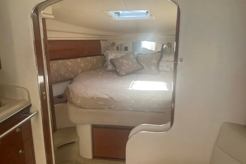 Slide: The Image of Interior cabin of 2003 Sea Ray 360 Sundancer with cozy bed and elegant decor. - 21
