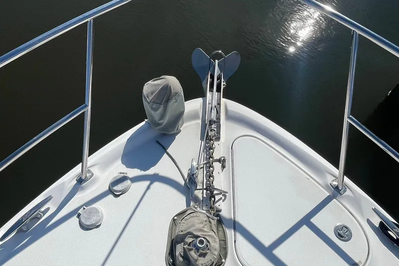Slide: The Image of Bow of 2003 Sea Ray 360 Sundancer with anchor and railings in sunlight. - 34