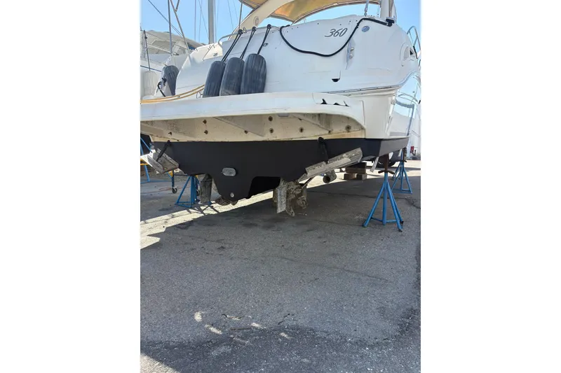 Slide: The Image of 2003 Sea Ray 360 Sundancer yacht on stands, rear view, in a boatyard. - 41
