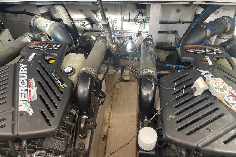 Slide: The Image of Engine room of a 2003 Sea Ray 360 Sundancer with twin Mercury engines. - 36